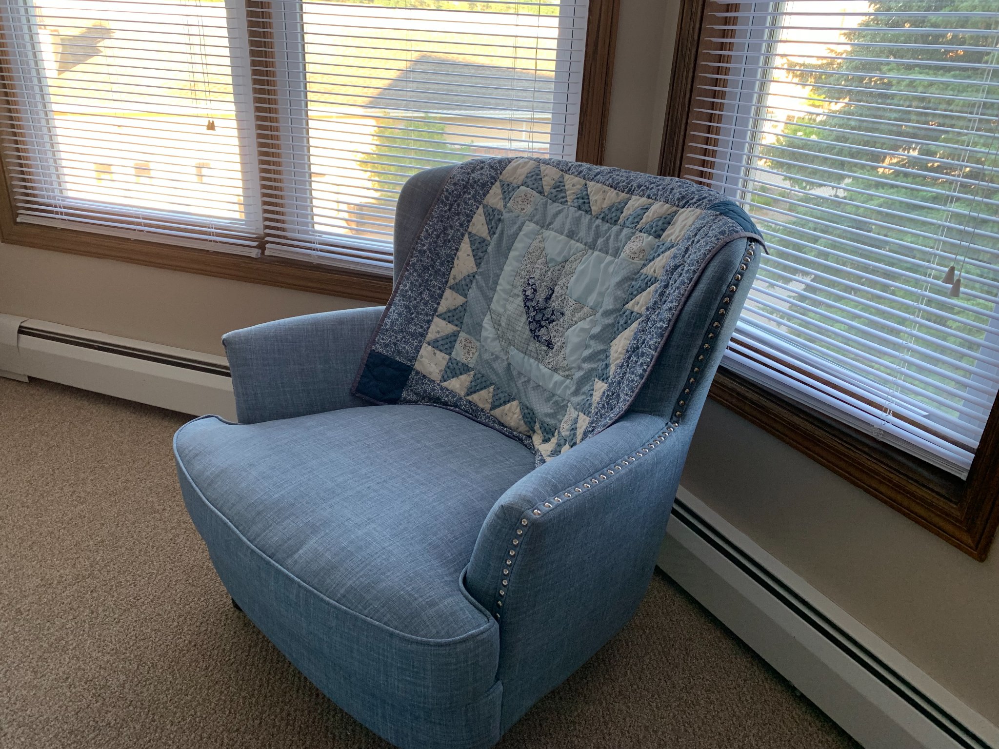 My Mom crafted the quilt draped over the back of the chair